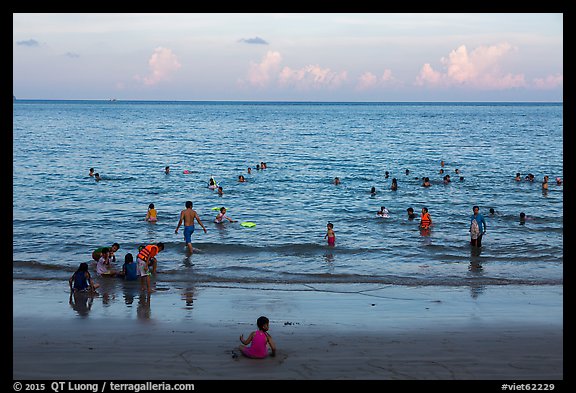 Beachgoers at sunset, Con Son. Con Dao Islands, Vietnam (color)