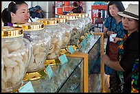 Women buying eddible birds nest. Con Dao Islands, Vietnam ( color)