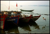 Children climbing aboard Fishing boat, Dong Hoi. Vietnam (color)