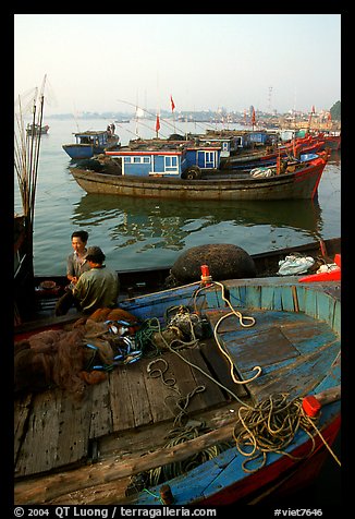 Fisherman relax in a boat, Dong Hoi. Vietnam (color)