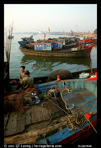 Fisherman relax in a boat, Dong Hoi. Vietnam