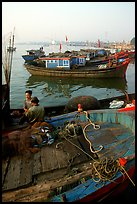 Fisherman relax in a boat, Dong Hoi. Vietnam