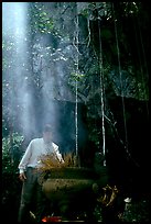 Urn and incense near the entrance of Phong Nha Cave. Vietnam ( color)