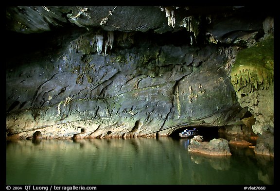 Tour boat getting out of a tunnel, Phong Nha Cave. Vietnam (color)