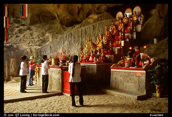 Women praying at the altar at the entrance of Tan Thanh Cave. Lang Son, Northest Vietnam (color)