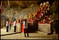 Women praying at the altar at the entrance of Tan Thanh Cave. Lang Son, Northest Vietnam ( color)
