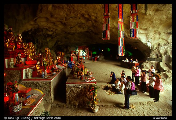 Group praying at the altar at the entrance of Tan Thanh Cave. Lang Son, Northest Vietnam