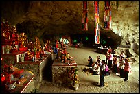 Group praying at the altar at the entrance of Tan Thanh Cave. Lang Son, Northest Vietnam (color)