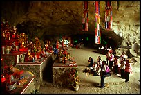 Group praying at the altar at the entrance of Tan Thanh Cave. Lang Son, Northest Vietnam