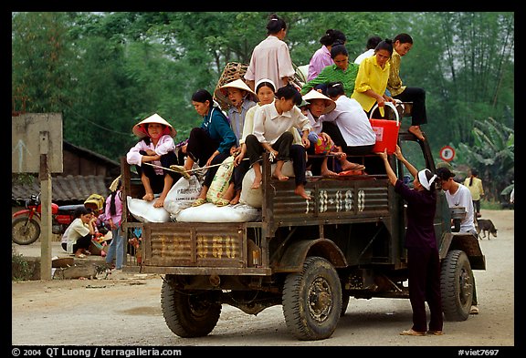 Riding in the back of an overloaded truck. Northest Vietnam (color)