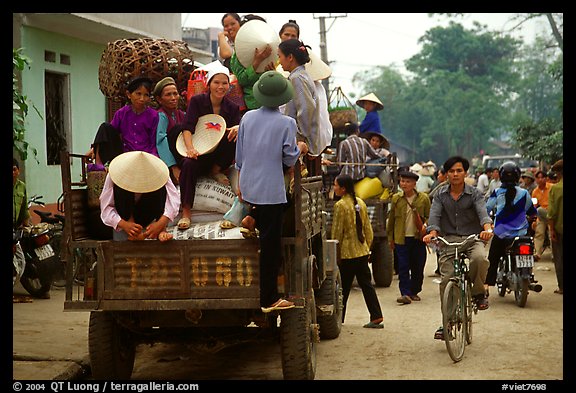 Riding in the back of an overloaded truck. Northest Vietnam (color)