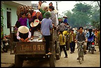 Riding in the back of an overloaded truck. Northest Vietnam (color)