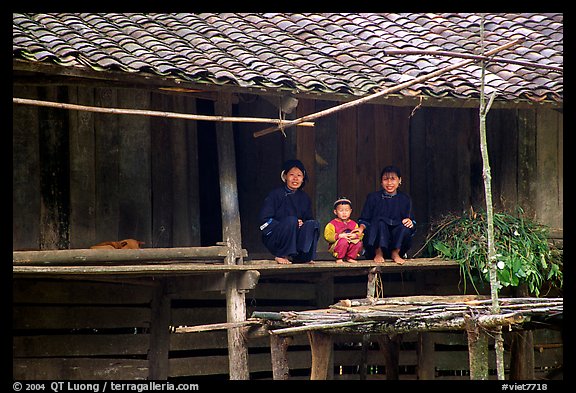 Women and child of the Nung ethnicity in front of their home. Northeast Vietnam (color)