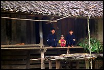 Women and child of the Nung ethnicity in front of their home. Northeast Vietnam