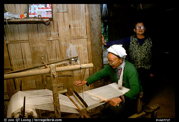 Elderly woman weaving in her home. Northeast Vietnam (color)