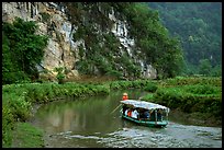 Shallow boats transport villagers to a market. Northeast Vietnam