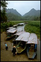 Boats waiting for villagers at a market. Northeast Vietnam (color)