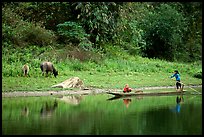 Children on a dugout boat. Northeast Vietnam (color)