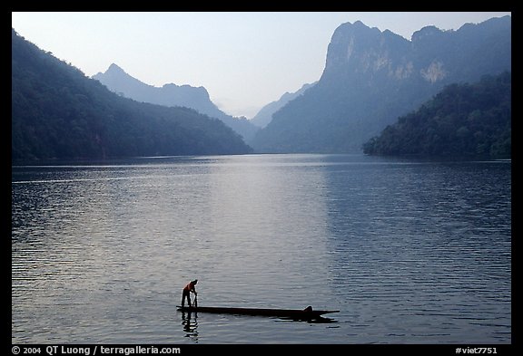 Fisherman on Dugout boat,  Ba Be Lake. Northeast Vietnam