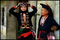 Two generations of tribewomen outside their house, near Mai Chau. Northwest Vietnam (color)