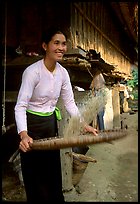 Woman of the Thai ethnicity sorting grain, near Mai Chau. Vietnam ( color)