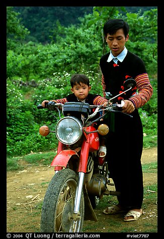 Hmong motorcyclist and boy, Xa Linh. Northwest Vietnam (color)