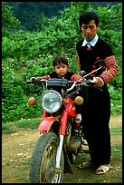 Hmong motorcyclist and boy, Xa Linh. Northwest Vietnam (color)