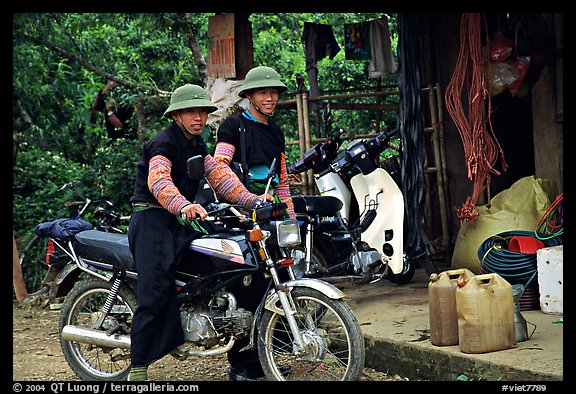 Two Hmong motorcyclists at the Xa Linh market. Northwest Vietnam