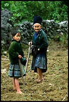 Elderly tribeswoman and girl doing field work  near Yen Chau. Northwest Vietnam (color)