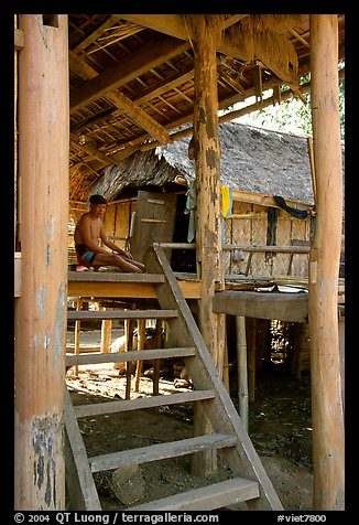 Elderly Montagnard man wearing the French beret on his porch, near Son La. Northwest Vietnam