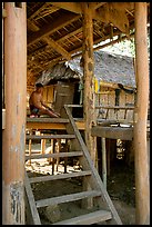 Elderly Montagnard man wearing the French beret on his porch, near Son La. Northwest Vietnam