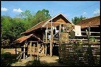 Woman drying laundry in a montagnard village near Son La. Northwest Vietnam ( color)