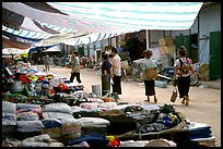 Thai women walk in a town market, near Son La. Northwest Vietnam ( color)