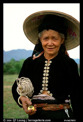 Thai woman wearing her traditional dress under the Vietnamese conical hat, near Son La. Northwest Vietnam (color)