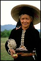 Thai woman wearing her traditional dress under the Vietnamese conical hat, near Son La. Northwest Vietnam