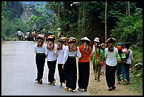 Young thai women walking on the road, between Son La and Tuan Chau. Northwest Vietnam (color)