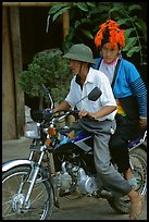 Dzao woman riding at the back of a motorbike, Tuan Giao. Northwest Vietnam