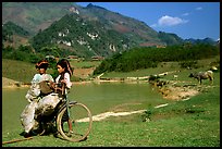 Thai women load a bicycle, near Tuan Giao. Northwest Vietnam