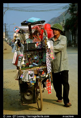 Street vendor uses his bicycle as a shop, Tam Duong. Northwest Vietnam (color)