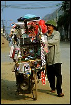 Street vendor uses his bicycle as a shop, Tam Duong. Northwest Vietnam (color)