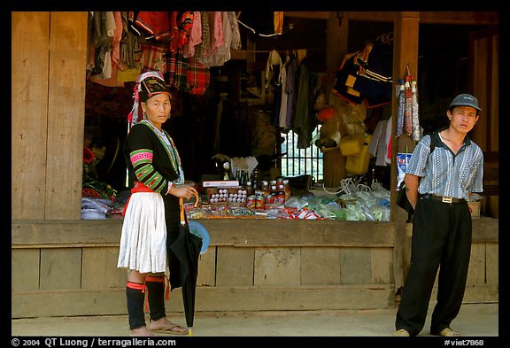 Man and montagnard woman in front of a store, near Lai Chau. Northwest Vietnam