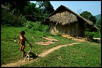 Unclothed child in a minority village, between Lai Chau and Tam Duong. Northwest Vietnam (color)