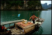 Peddling from a boat. Halong Bay, Vietnam