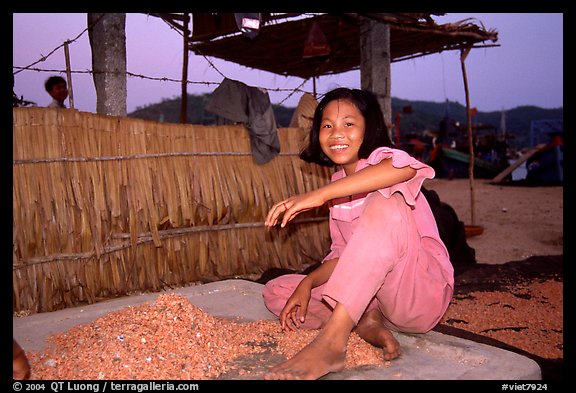 Girl drying shrimp. Ha Tien, Vietnam