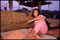 Girl drying shrimp. Ha Tien, Vietnam