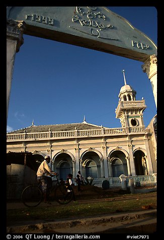 Bicylist in front of a mosque. Chau Doc, Vietnam (color)