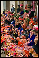 Flower hmong women sell colorful clothing at the market. Bac Ha, Vietnam