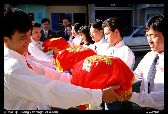 Gifts are exchanged in front of the bride's home. Ho Chi Minh City, Vietnam (color)