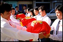 Gifts are exchanged in front of the bride's home. Ho Chi Minh City, Vietnam (color)