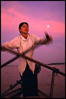 Woman using X-shaped paddles on the Mekong river, Can Tho. Vietnam